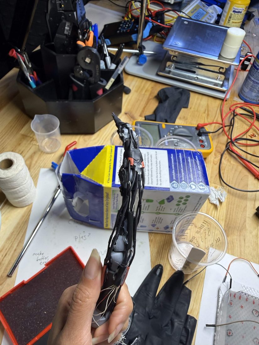 black heat-shrink wrapped talon finger prototype
